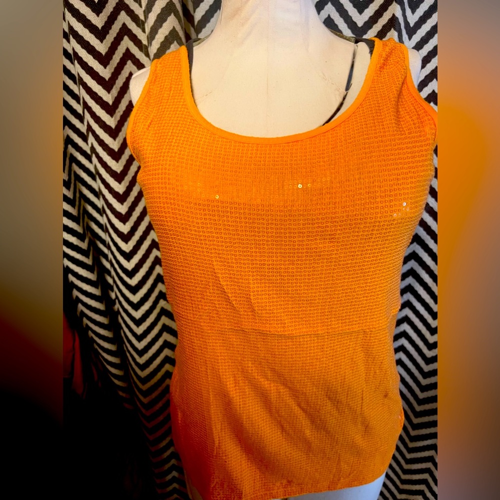 Orange tank top. Front is sparkly. From Maurice’s